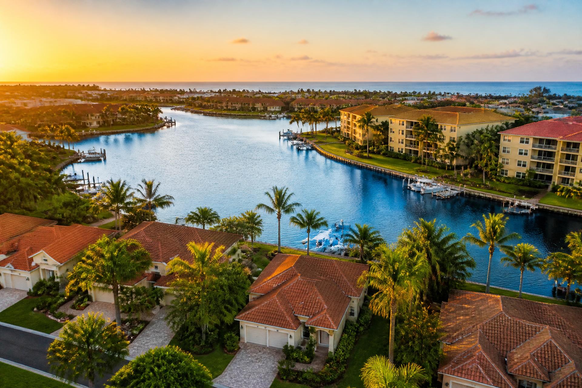 Aerial view of a Florida waterfront residential community at sunset